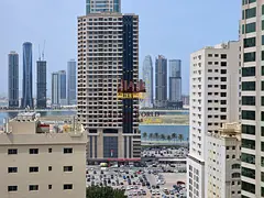 Two-bedroom apartment with a living room in Al Majaz 3, balcony with sea view, two master bedrooms,
