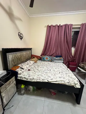 Wooden bed frame with upholstered headboard - used