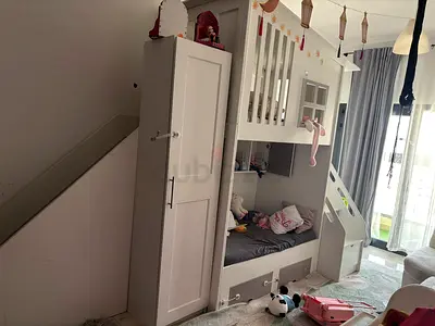 Home center tree bed with slide and alot of storage for urgent sale