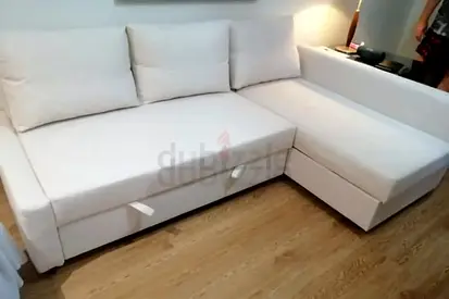 White L-shaped Sofa Bed with Storage - Good Condition