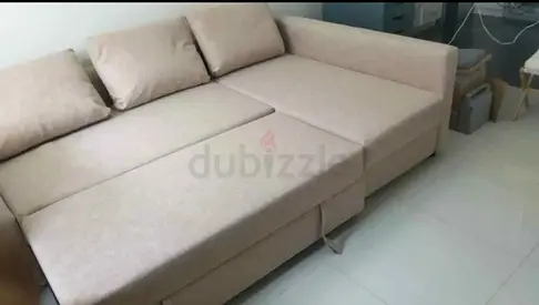 Light beige L-shaped sofa bed, good condition