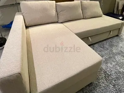 Beige L-shaped Sofa Bed with Storage - Good Condition