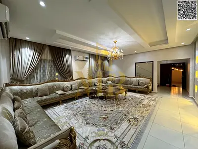 Luxury villa in Al Muwaihat 1, fully furnished with a yard and all utilities including electricity, water, and air conditioning.