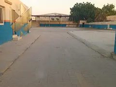 Yard in Industrial 4 with 20000 sqft offices 6 staff rooms and 50 KW power rent AED 400000 negotiabl
