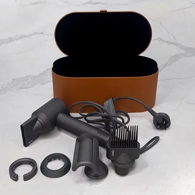 Dyson Supersonic hair dryer with attachments and storage case - used