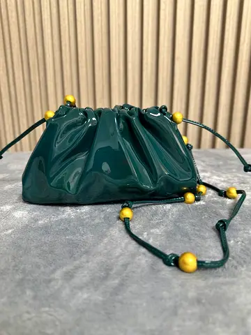 Green Patent Leather Drawstring Pouch with Gold Bead Accents