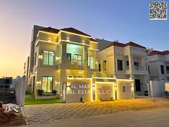 Two-story villa with a roof terrace, price inclusive of registration fees, in one of Ajman's mos