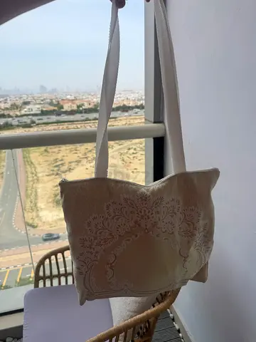 Bag with prayer mat and long dress 20 AED 💰