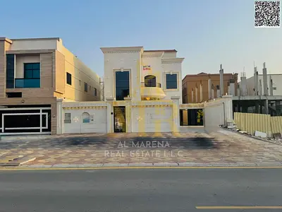 Two-story villa with a rooftop terrace, including electricity, water, and air conditioning, in one of Ajman's most prestigious areas. Freehold ownersh