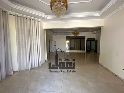 Villa for sale in Wasit Al-Moufjah suburb with an area of 12,000 sq ft, 7 bedrooms, and 2 annexes. Price: 2,600,000 AED