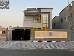 Two-story villa with a roof terrace, including air conditioning, in one of Ajman's most prestigi