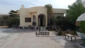 Corner villa for sale in Al Khuzamiya with an area of 12,000 sq ft, 3 bedrooms, price 1,350,000 AED