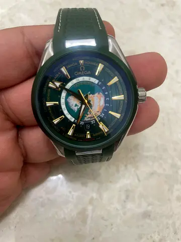 Mens world-time style wristwatch with green strap