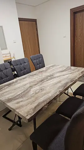 Dining table + 6 chairs — marble-look top