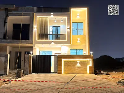 Two-story villa with a rooftop terrace, price includes registration and ownership fees, located on the main street, ready to move in, in one of Ajman'