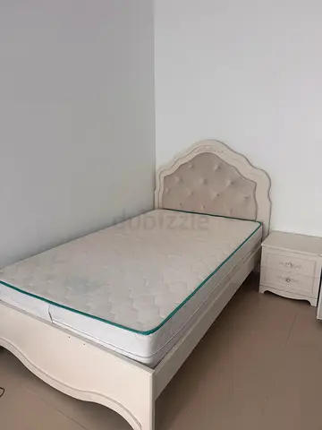 Bed with side table and mattress
