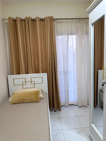 Spacious Closed Partition Room with Balcony for Rent in Qasimia Sharjah