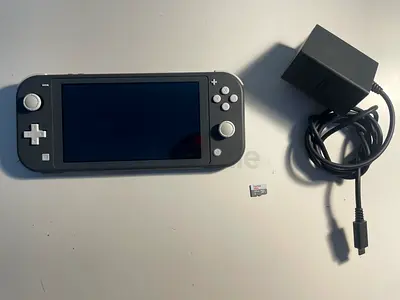 Nintendo Switch Lite (Grey) – Barely Used – Excellent Condition