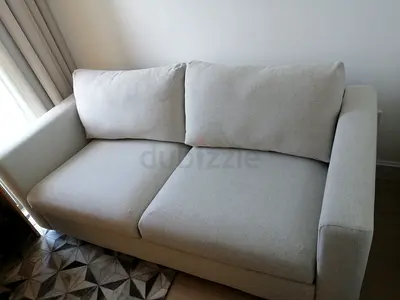 Beige colours 2-seater fabric sofa bed in good condition
