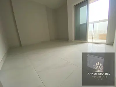 For annual rent in Ajman, Al Jurf 3: a two-bedroom apartment with a living room, central air conditioning, a balcony with an open view, a prime locati