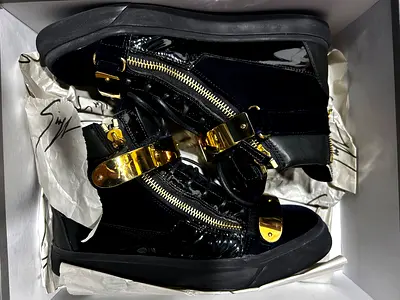Stylish Black High-Top Sneakers with Gold Accents