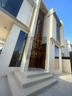 New villa for sale in Al Rawda 1 on 2 streets, 5 master rooms, majlis, 2 halls, maid room, central A