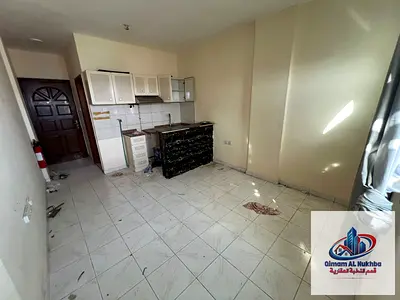 Studio for annual rent in Al Butina - large and distinctive kitchen - spacious area - price 15,000 dirhams only - air conditioning and central gas - v