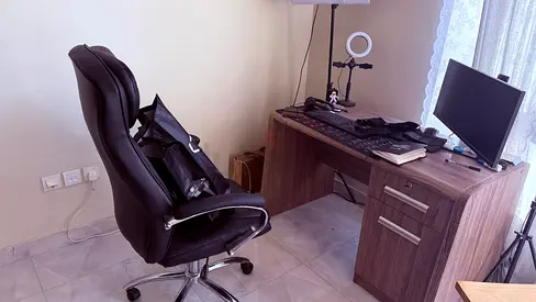 Computer desk with black ergonomic office chair (used)