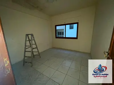 Two-room apartment and a living room for annual rent in Al Butina - central air conditioning and gas - price 30 thousand dirhams only - spacious area
