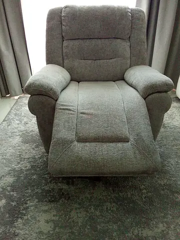 Grey fabric recliner armchair 360 degree rotating recliner - gently used