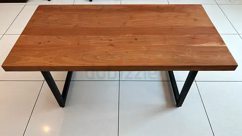 Sturdy solid wood table with black metal legs (used)