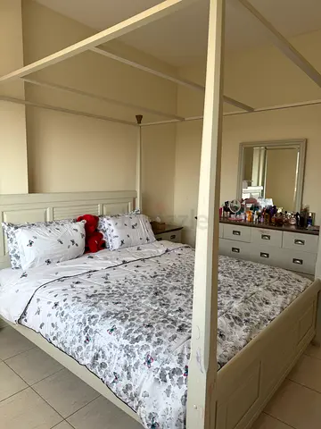 Four-poster bed frame with matching dresser - used, good condition