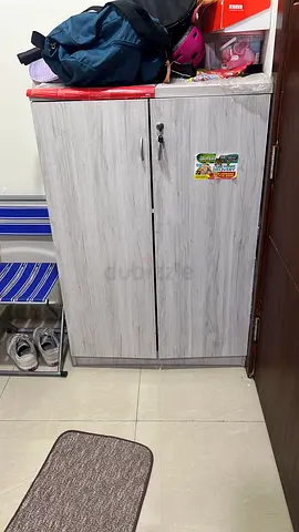 Light grey two-door shoe cupboard/ storage cabinet - good condition