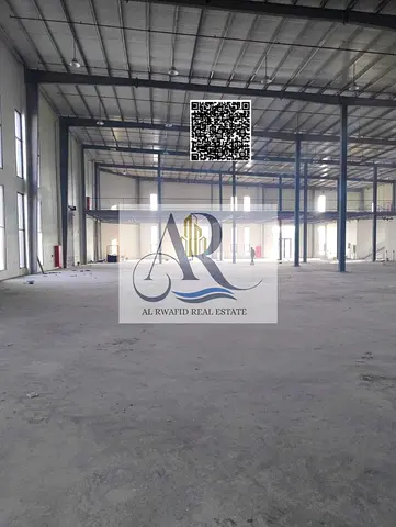 A prime warehouse in the Emirate of Umm Al Quwain, located in a specific industrial and commercial area, boasts easy access to a major highway, facili