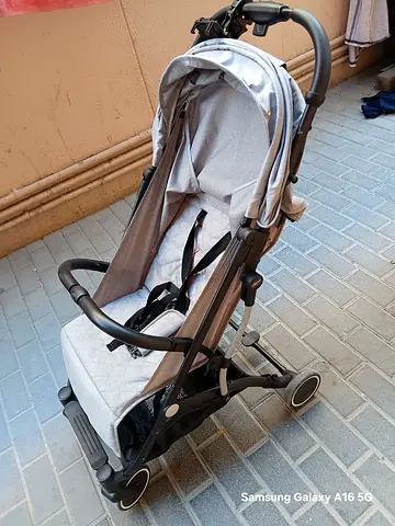 Lightweight grey baby stroller in good condition