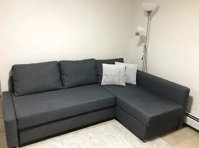 Grey L-shaped Sofa Bed with Storage — Good Condition
