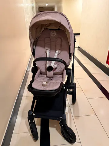 Lightweight beige single stroller with canopy and storage basket cybex priam matt black