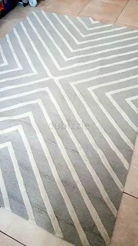 Light grey geometric area rug — good condition