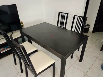 Solid Black Wooden Dining Table with 4 Chairs - Good Condition