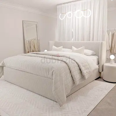Modern Bed with Stylish Bedding and Decorative Rug
