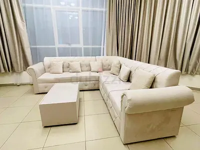 Large L-shaped Cream Fabric Corner Sofa with Coffee Table - Good Condition