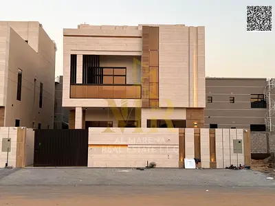 Two-story villa with a roof terrace, price includes registration and ownership fees, in one of Ajman's most prestigious areas. Freehold ownership avai