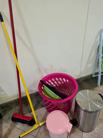 Set of household cleaning tools — broom, dustpan, small trash bin and accessories