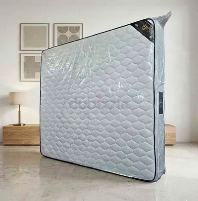 Almost-new Queen Size Mattress — Clean, Stored in Cover