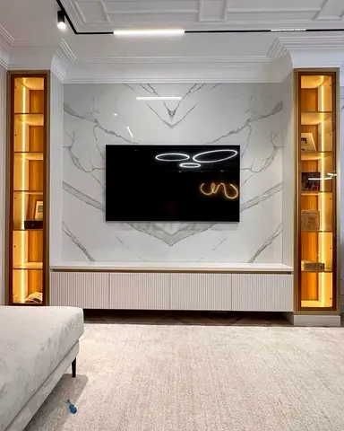 Modern Built-in Entertainment Wall Unit with Marble Backdrop and LED Shelves