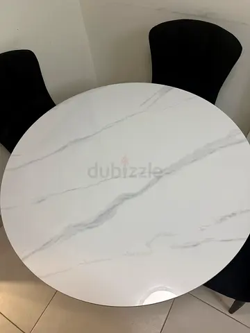 Round Marble-Effect Dining Table (White) with Black Chairs