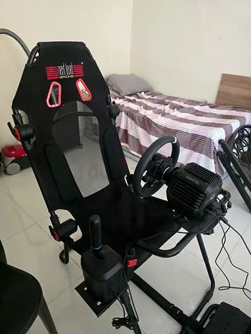 Selling my racing wheel pedal set with stand — used, working. Ps5 + 2 game pads + steering wheel +
