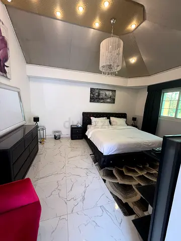 Modern black bedroom set with king bed, dresser and nightstands — excellent condition