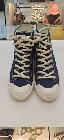 Used navy high-top canvas sneakers with white rubber sole — size unknown