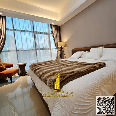 Luxury one-bedroom apartment with a balcony, gym, and swimming pool, fully furnished, for monthly rent in Ajman - Al Rashidiya 1 - Gulfa Tower